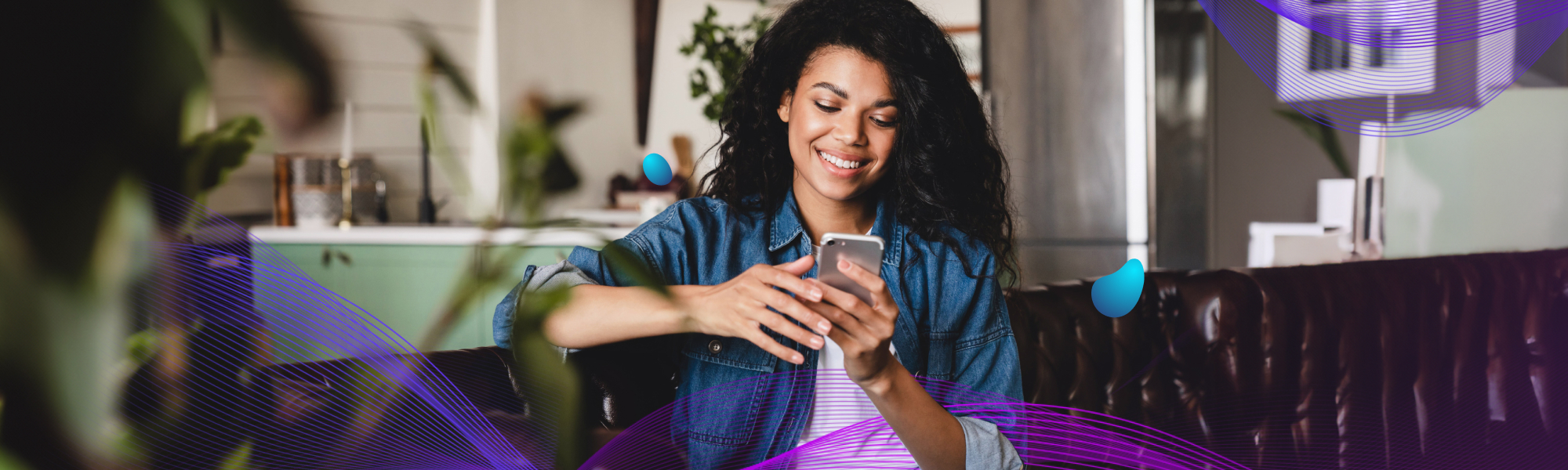 Woman sitting on a couch looking at her phone